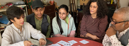Artists collaborating on Mithila letterform drawings