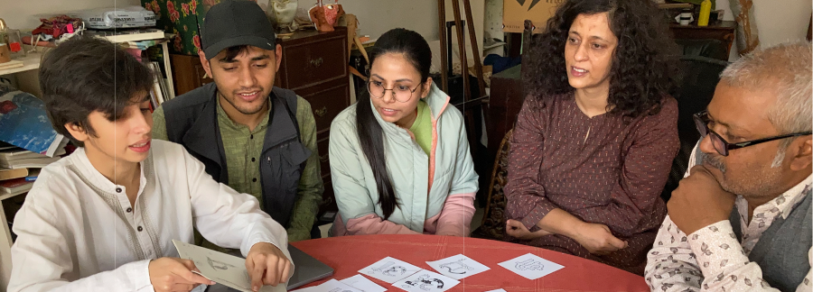 Artists collaborating on Mithila letterform drawings